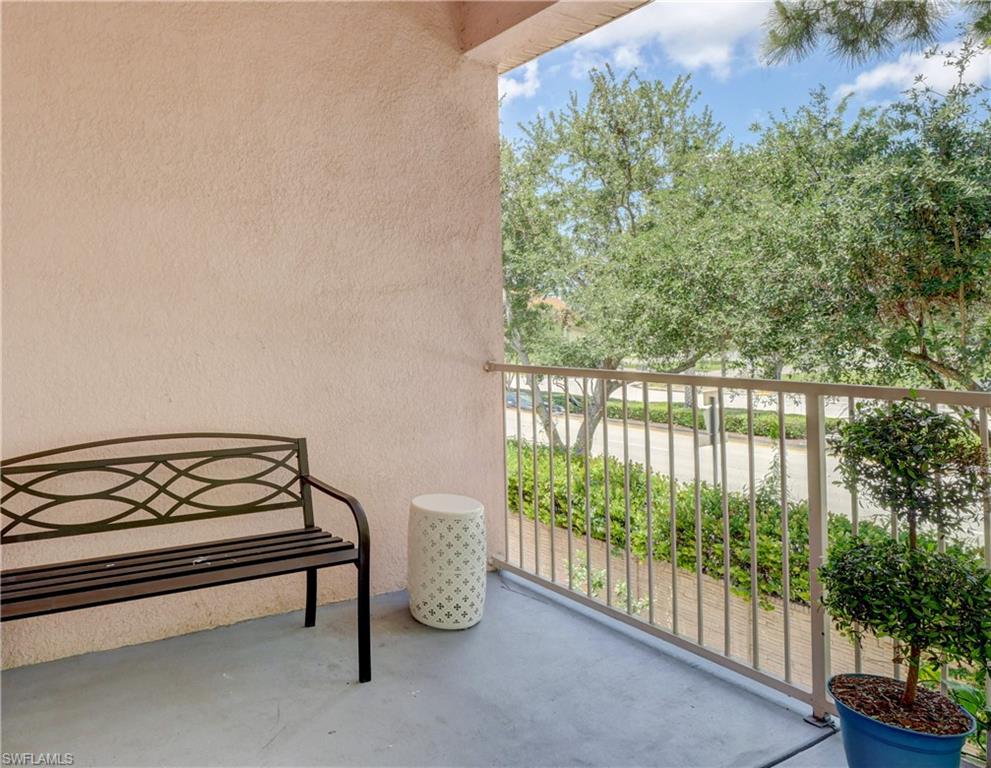 990 Peggy Circle, Unit 404 Naples, FL 34113 - Photo 22 of 26 a view of a bench in balcony