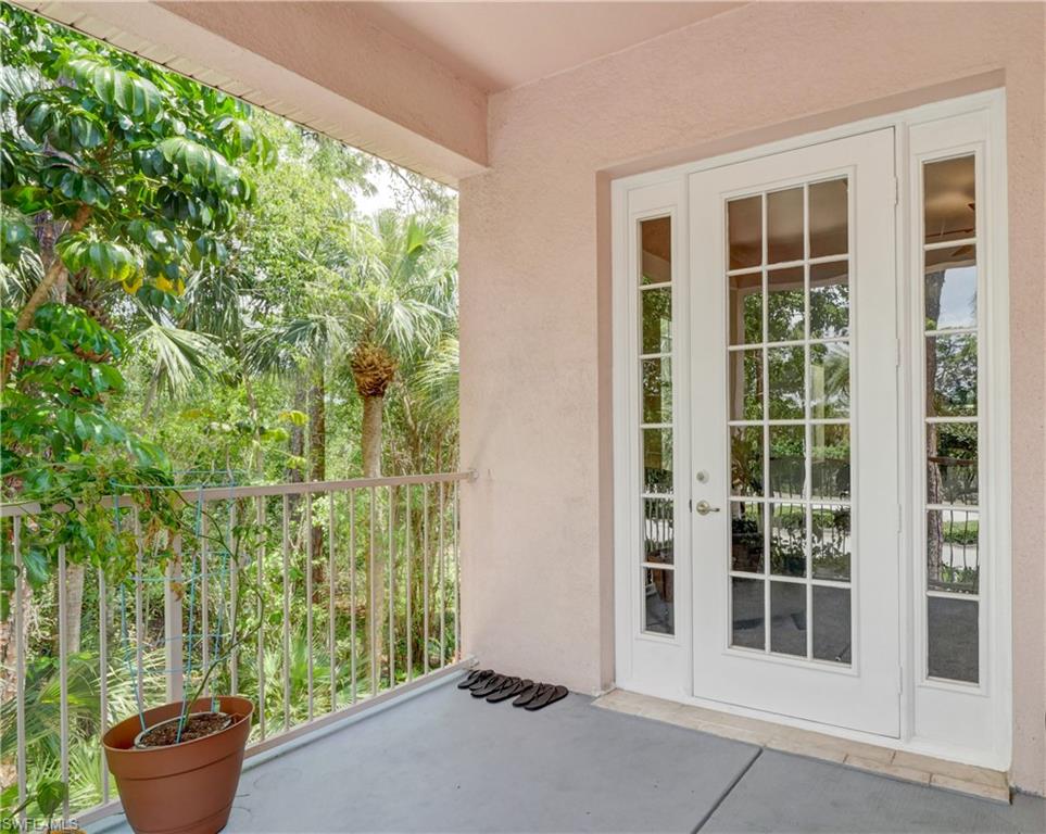 990 Peggy Circle, Unit 404 Naples, FL 34113 - Photo 23 of 26 a view of front door and porch of the house