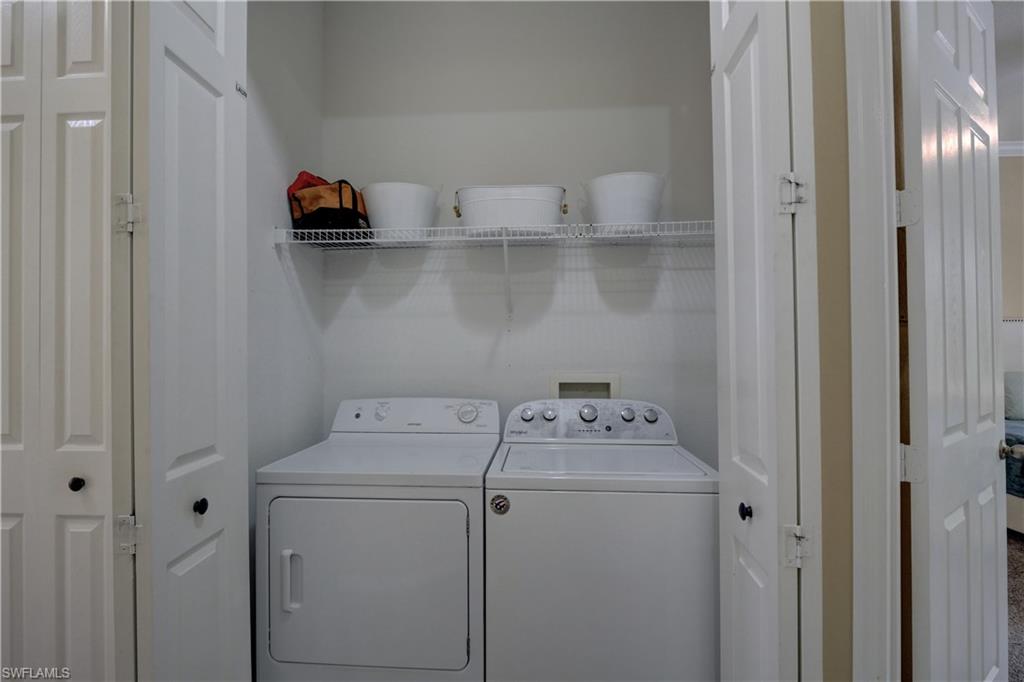 990 Peggy Circle, Unit 404 Naples, FL 34113 - Photo 24 of 26 a utility room with dryer and washer
