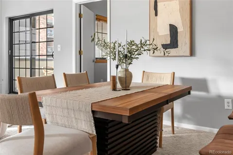 a dining room with furniture and window