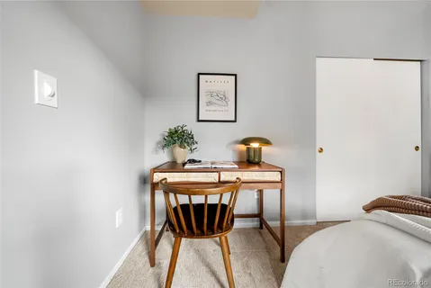 a view of a workspace with furniture