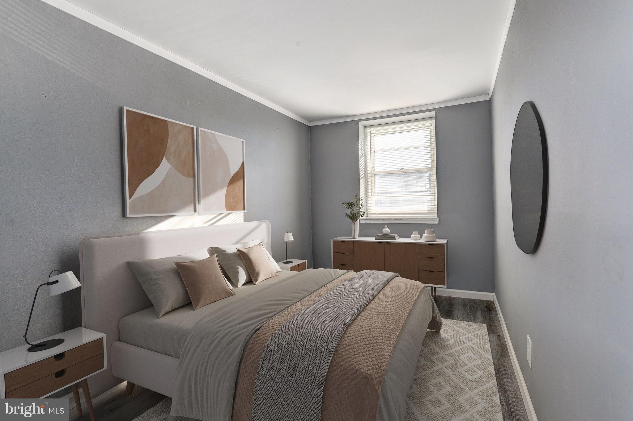 2707 Marbourne Avenue Baltimore, MD 21230 - Photo 11 of 14 a bedroom with a bed a mirror and a window