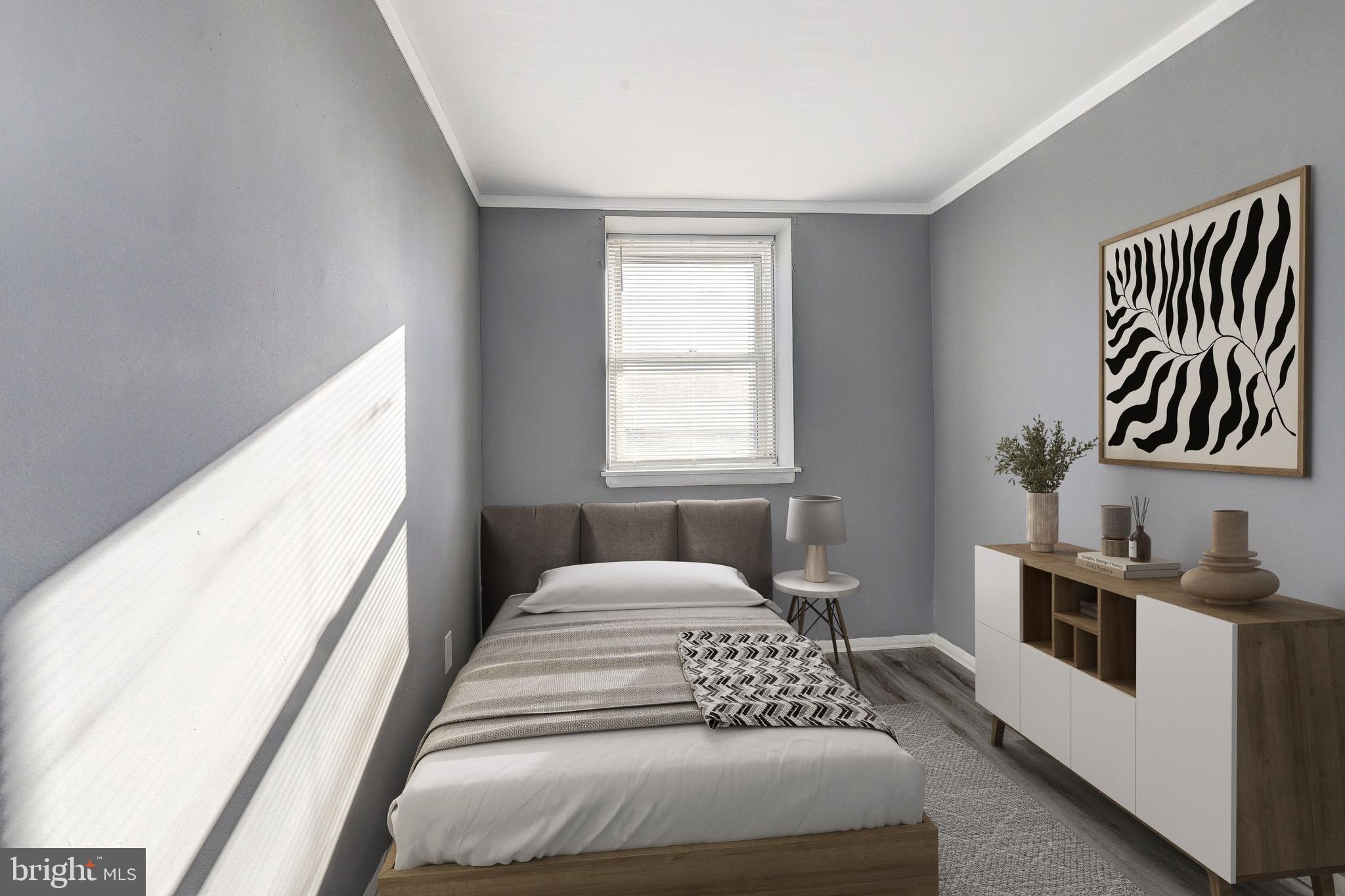 2707 Marbourne Avenue Baltimore, MD 21230 - Photo 13 of 14 a bedroom with a bed and a window