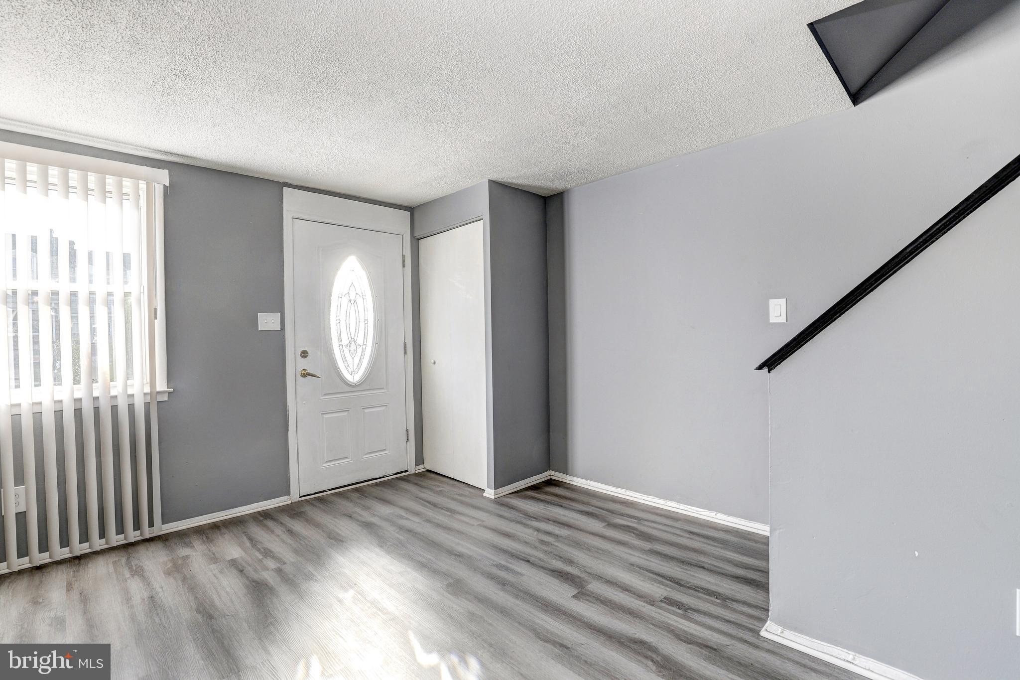 2707 Marbourne Avenue Baltimore, MD 21230 - Photo 2 of 14 a view of empty room with wooden floor and fan