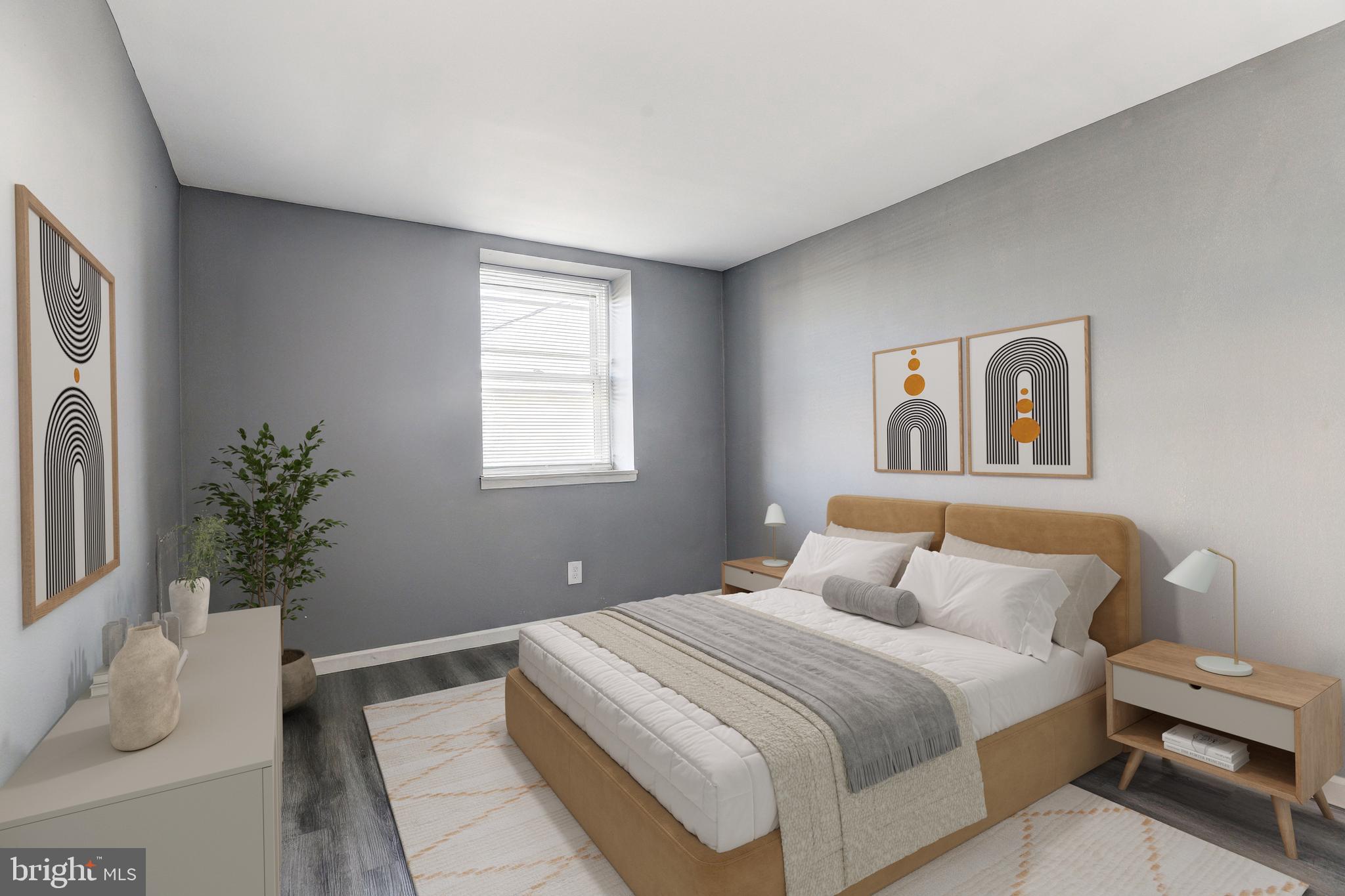 2707 Marbourne Avenue Baltimore, MD 21230 - Photo 9 of 14 a bedroom with a bed and a potted plant