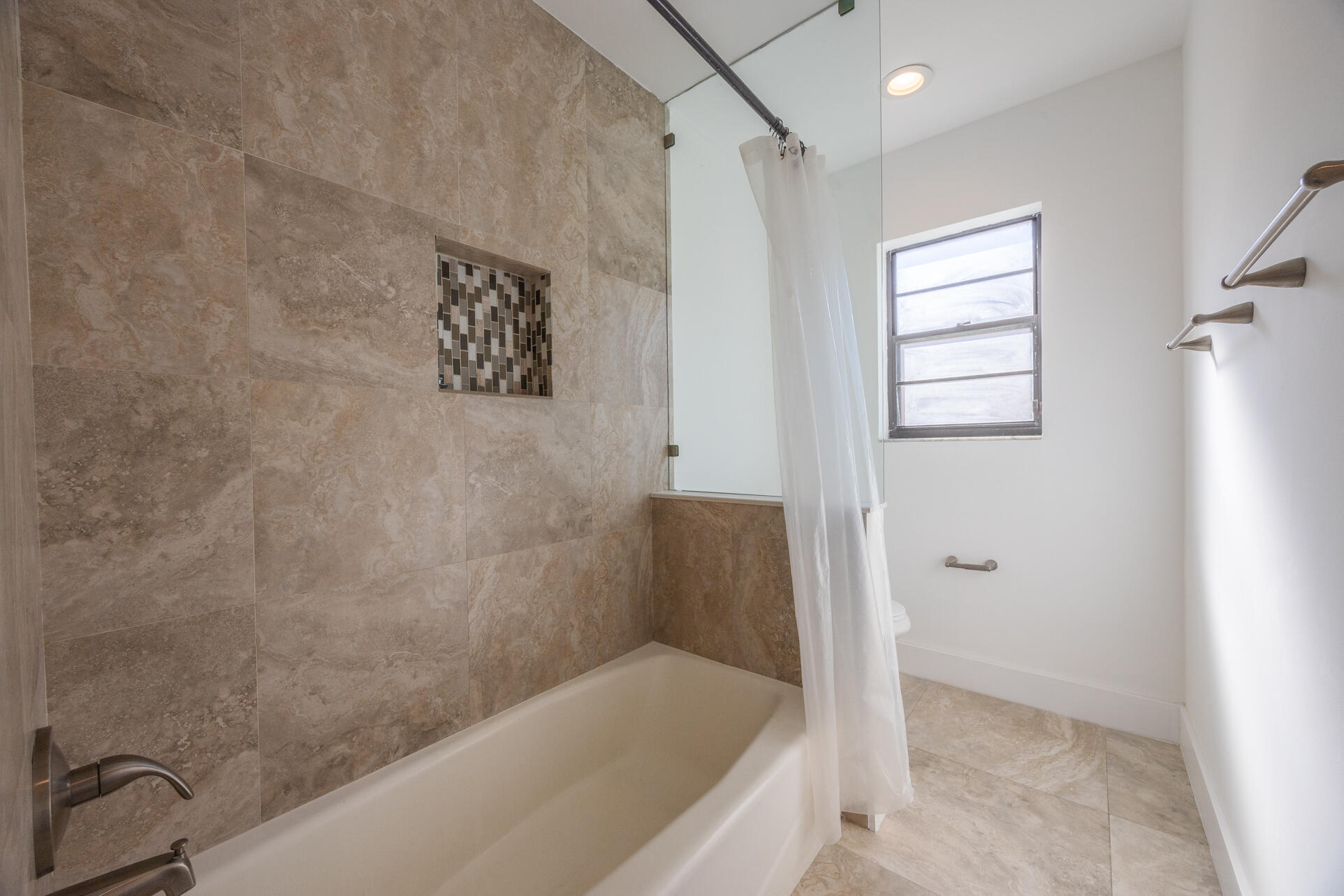 22352 Martella Avenue Boca Raton, FL 33433 - Photo 11 of 26 a bathroom with a bathtub and shower