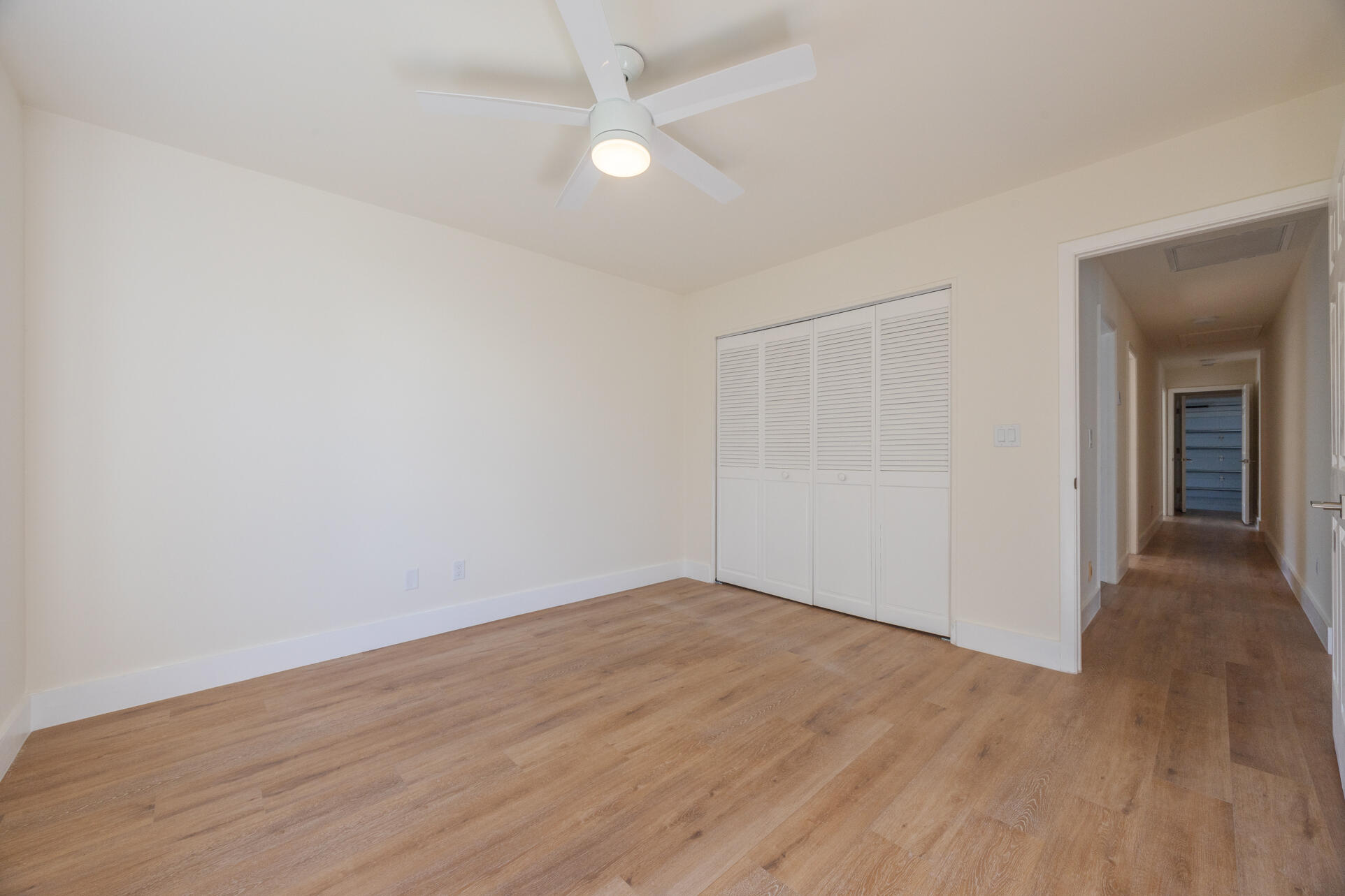 22352 Martella Avenue Boca Raton, FL 33433 - Photo 13 of 26 wooden floor in an empty room