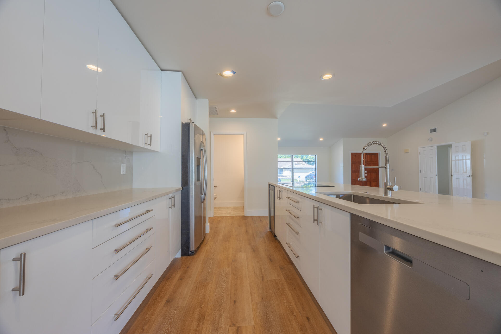22352 Martella Avenue Boca Raton, FL 33433 - Photo 17 of 26 a large kitchen with stainless steel appliances a sink and cabinets