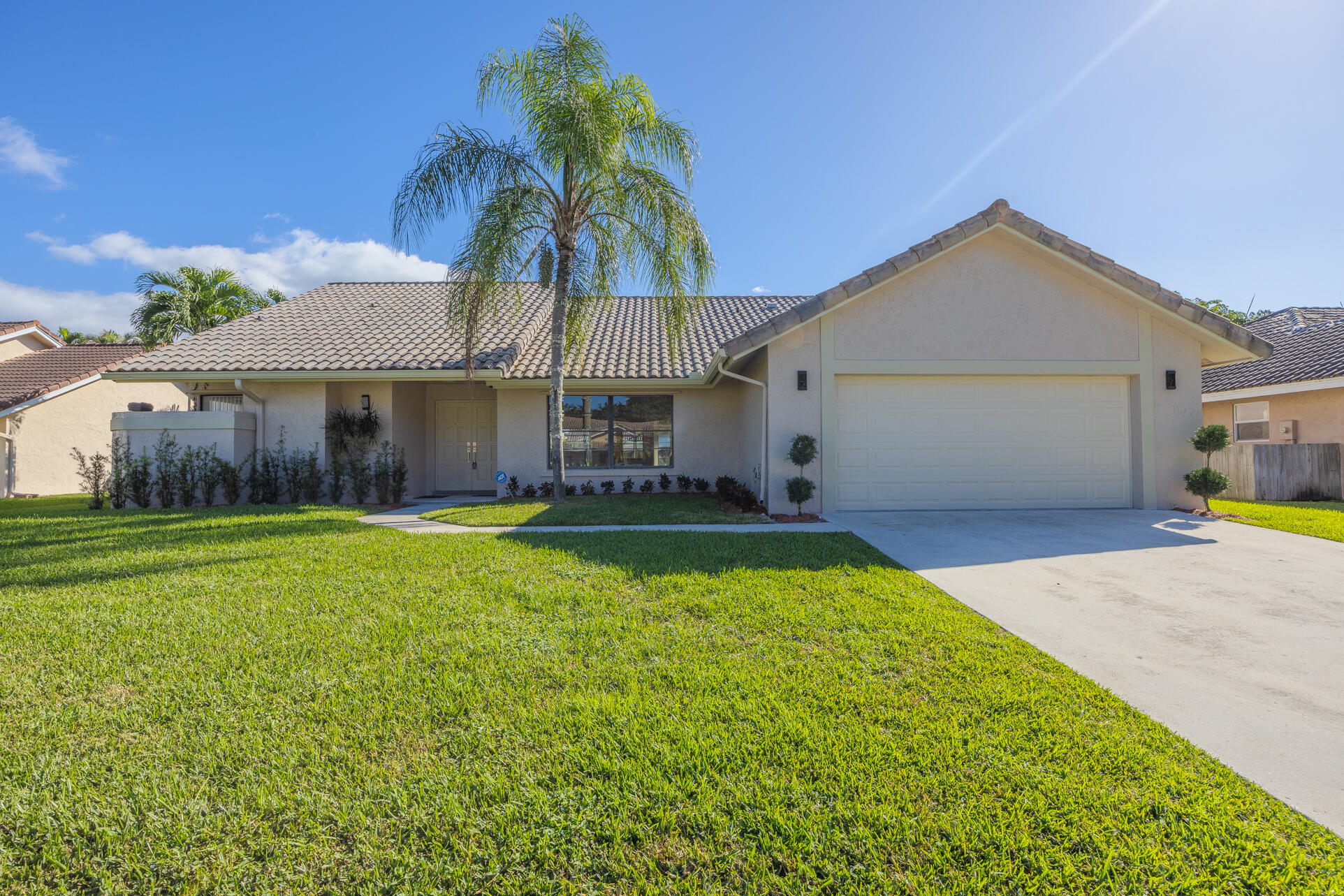 22352 Martella Avenue Boca Raton, FL 33433 - Photo 2 of 26 a view of a house with a backyard and a tree