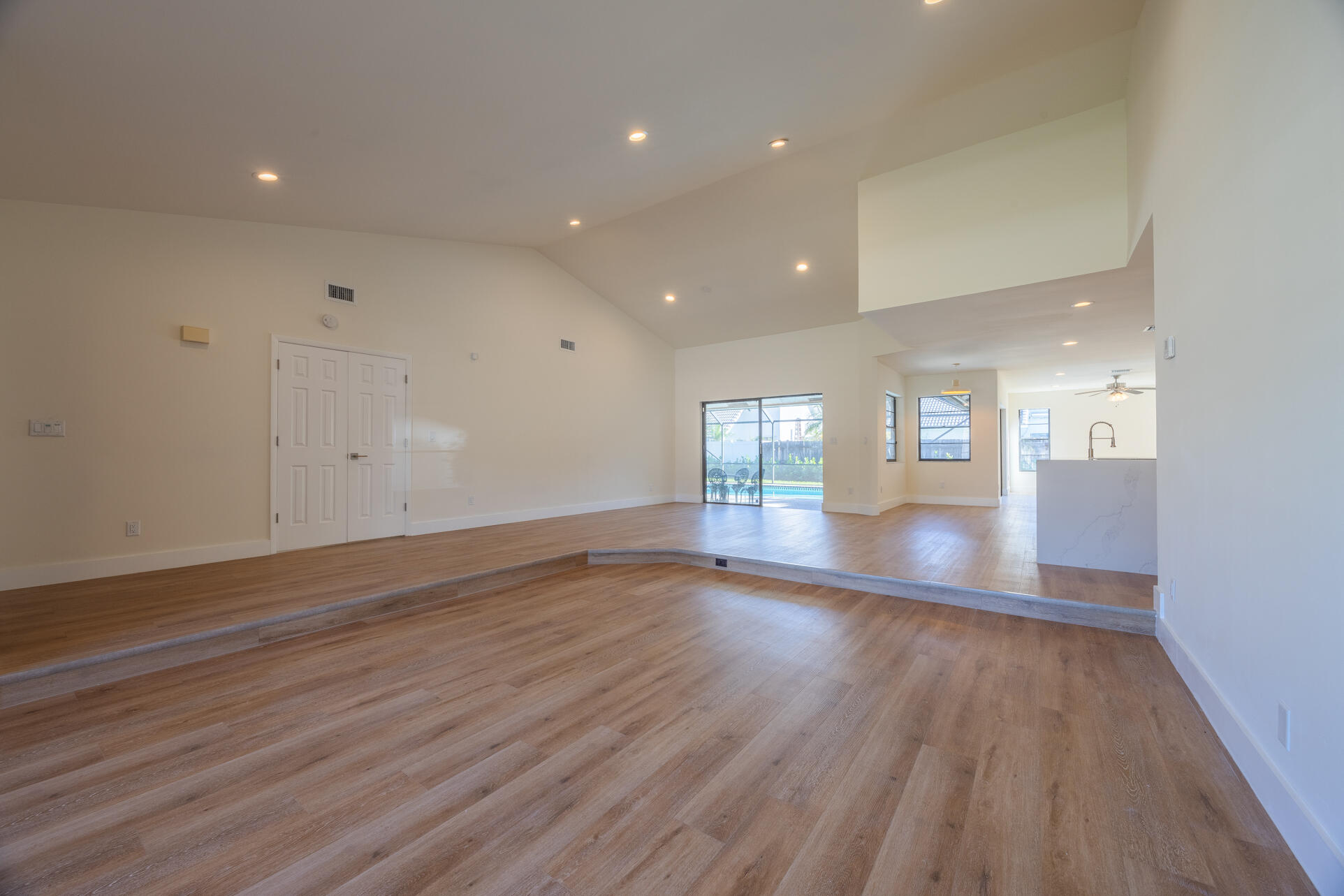 22352 Martella Avenue Boca Raton, FL 33433 - Photo 21 of 26 an empty room with wooden floor and windows