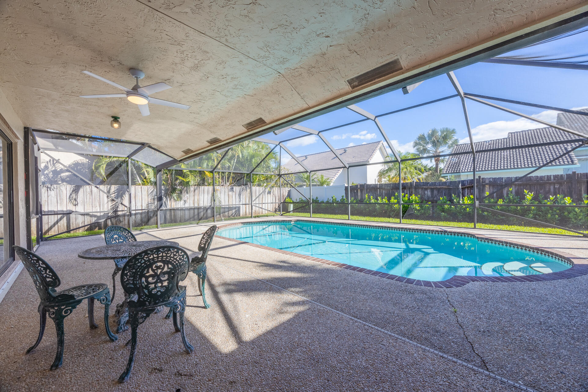 22352 Martella Avenue Boca Raton, FL 33433 - Photo 25 of 26 a view of swimming pool with outdoor seating and yard in the back