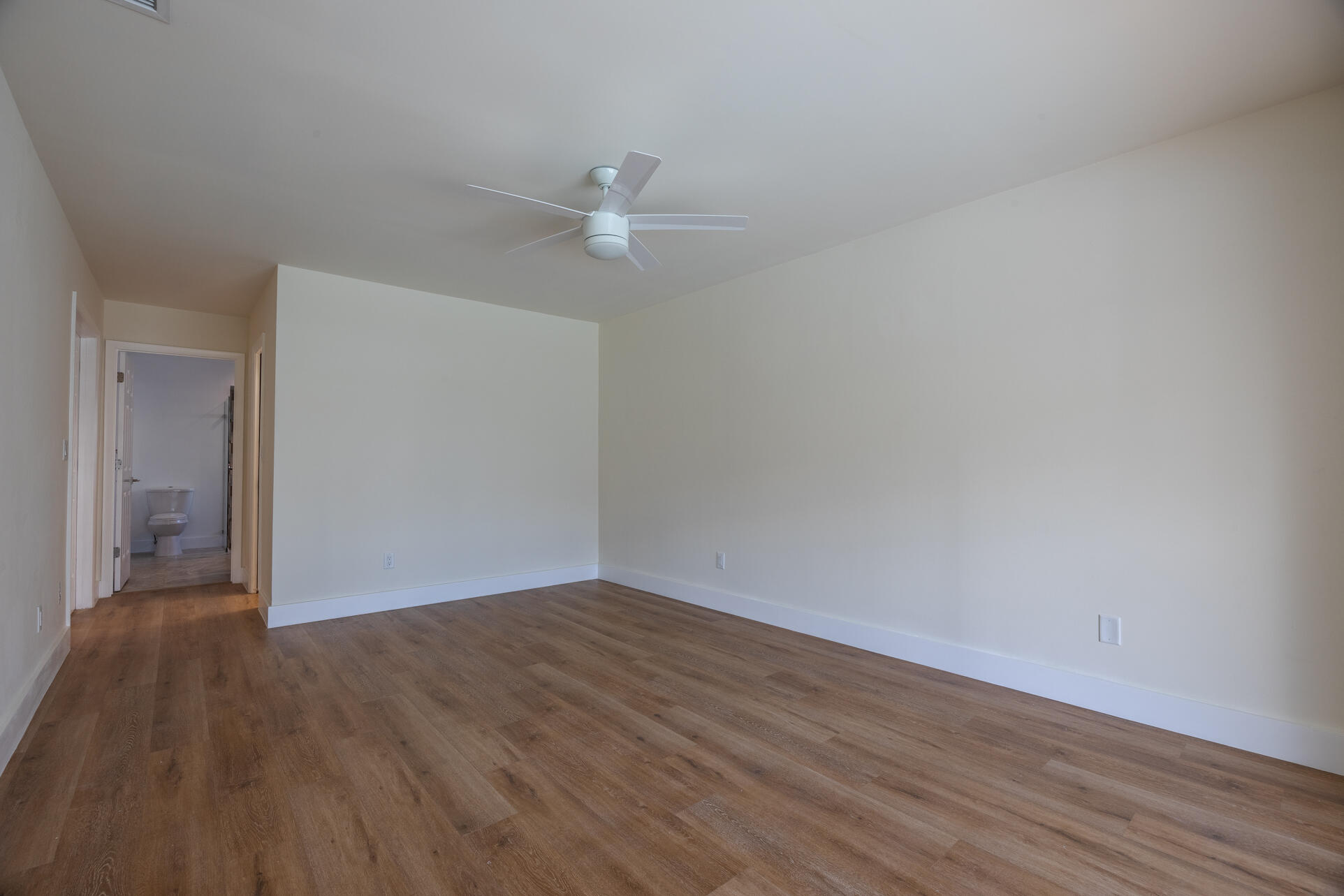 22352 Martella Avenue Boca Raton, FL 33433 - Photo 3 of 26 wooden floor in an empty room