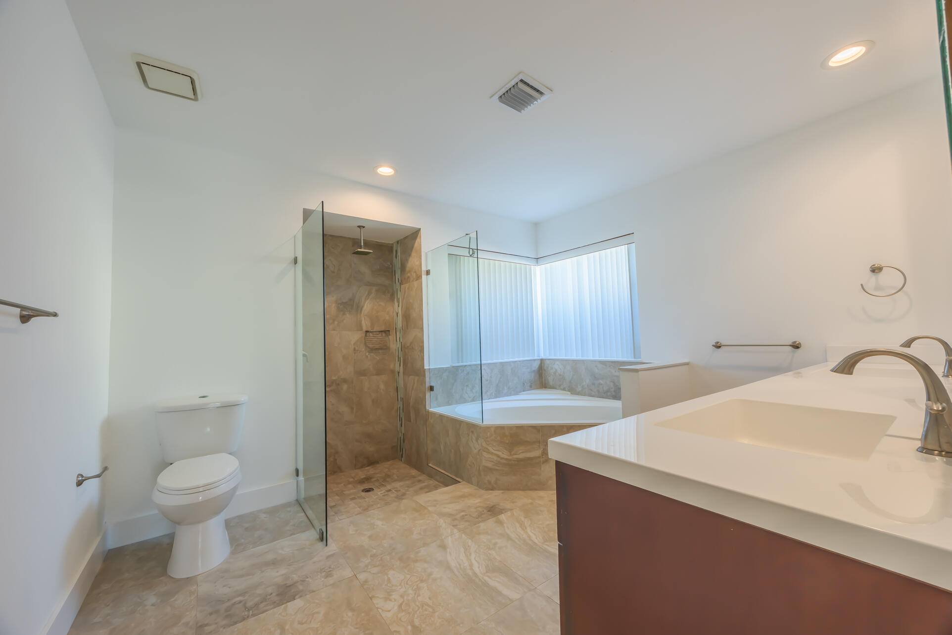 22352 Martella Avenue Boca Raton, FL 33433 - Photo 6 of 26 a bathroom with a sink a toilet and shower