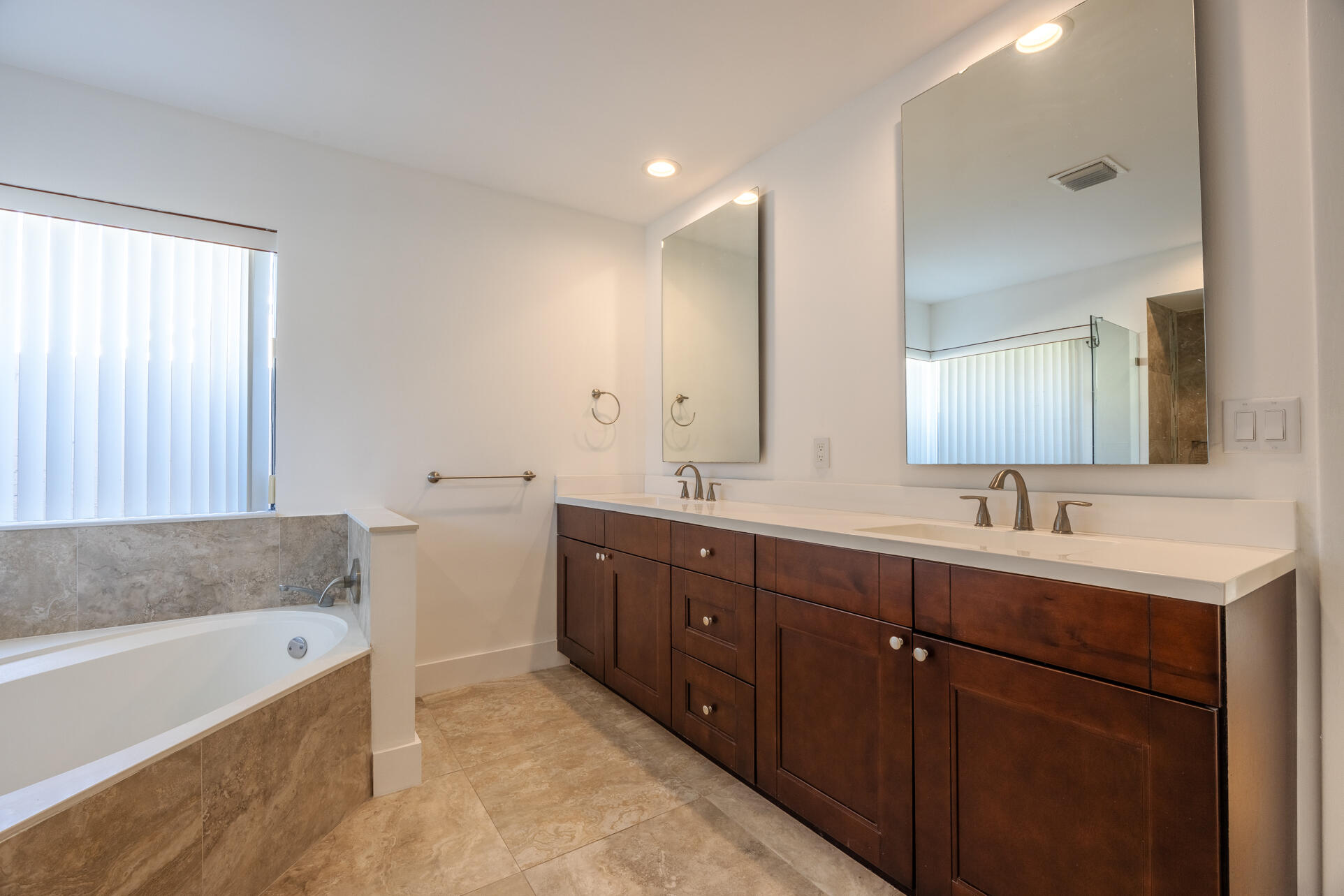 22352 Martella Avenue Boca Raton, FL 33433 - Photo 8 of 26 a bathroom with a tub sink and mirror