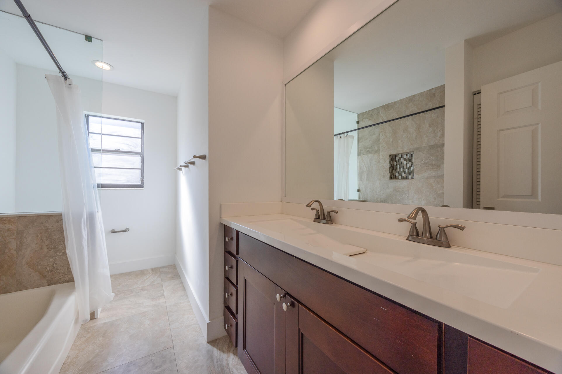 22352 Martella Avenue Boca Raton, FL 33433 - Photo 10 of 26 a bathroom with a sink and a mirror