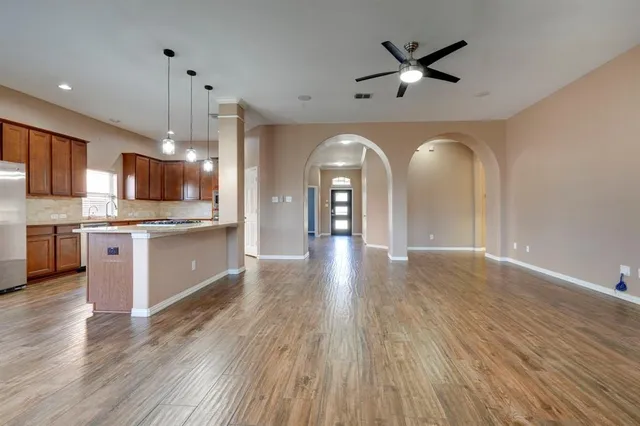 a view of kitchen with cabinets and wooden floor