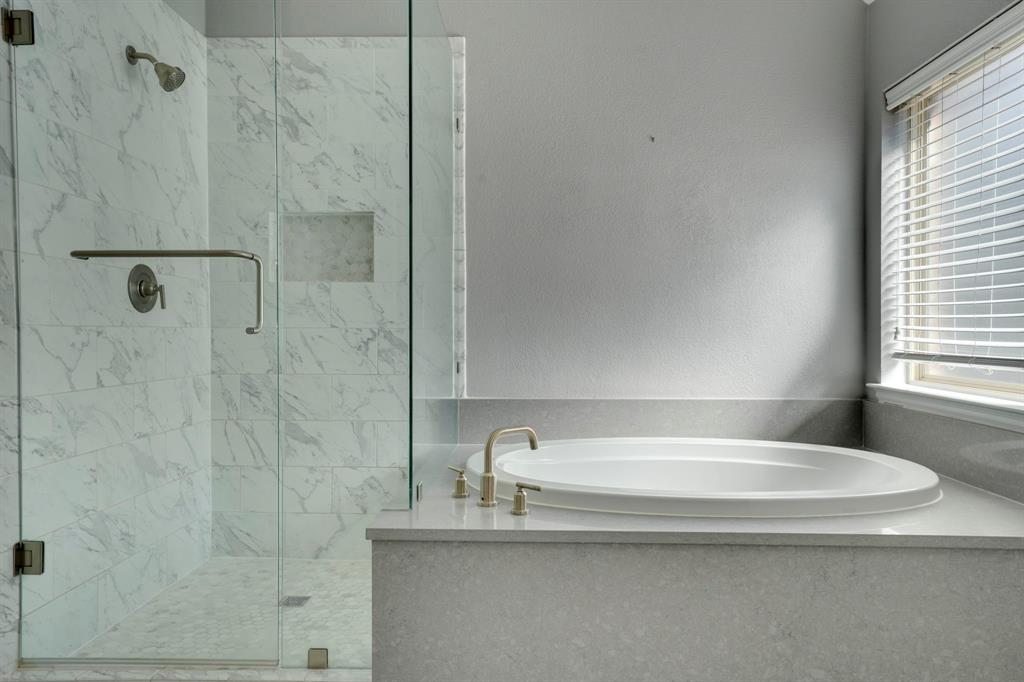 7519 Forest Ridge Trail Sachse, TX 75048 - Photo 25 of 35 a bathroom with a granite countertop sink a toilet and shower