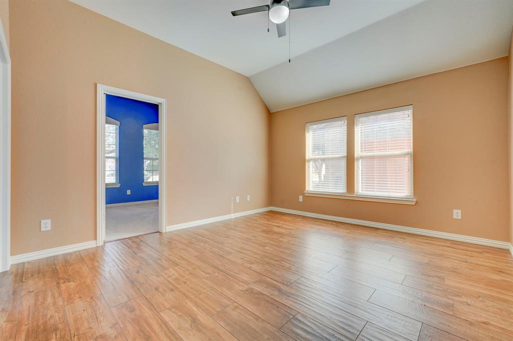 7519 Forest Ridge Trail Sachse, TX 75048 - Photo 28 of 35 a view of an empty room with wooden floor and a window