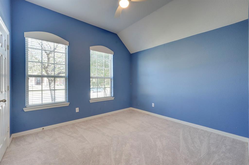 7519 Forest Ridge Trail Sachse, TX 75048 - Photo 29 of 35 an empty room with windows and closet