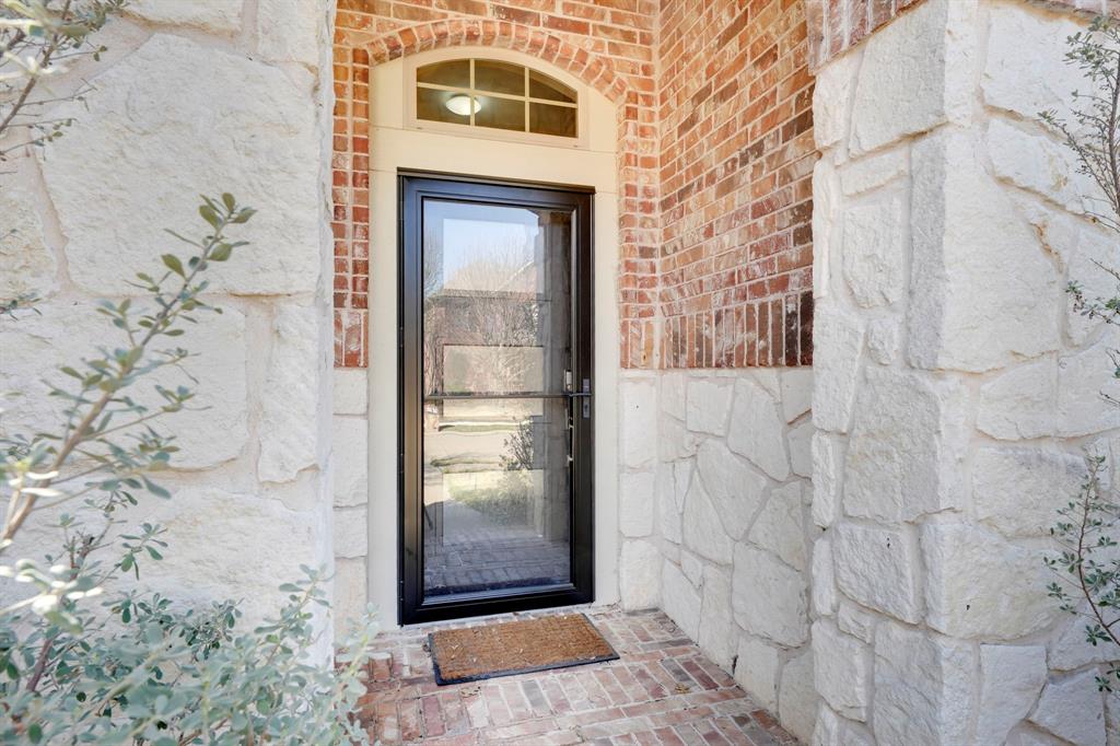7519 Forest Ridge Trail Sachse, TX 75048 - Photo 3 of 35 a bathroom with a shower and a mirror