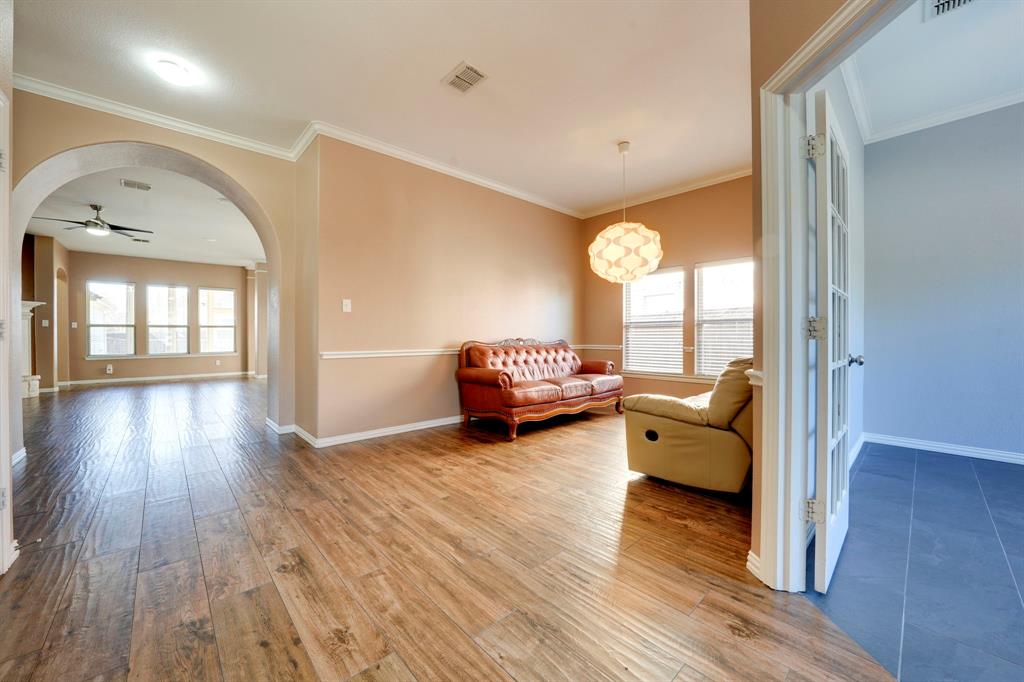 7519 Forest Ridge Trail Sachse, TX 75048 - Photo 4 of 35 a living room with furniture and a large window