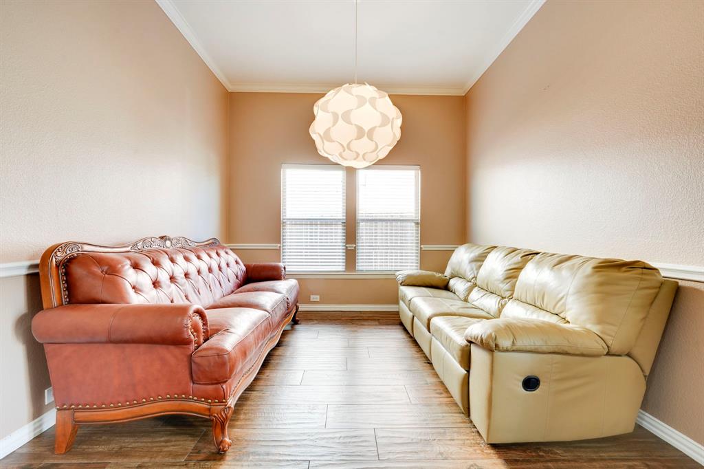 7519 Forest Ridge Trail Sachse, TX 75048 - Photo 6 of 35 a living room with furniture and a large window