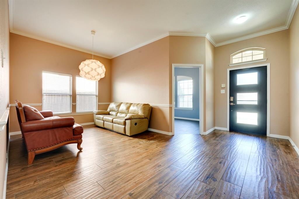 7519 Forest Ridge Trail Sachse, TX 75048 - Photo 8 of 35 a living room with furniture and a large window