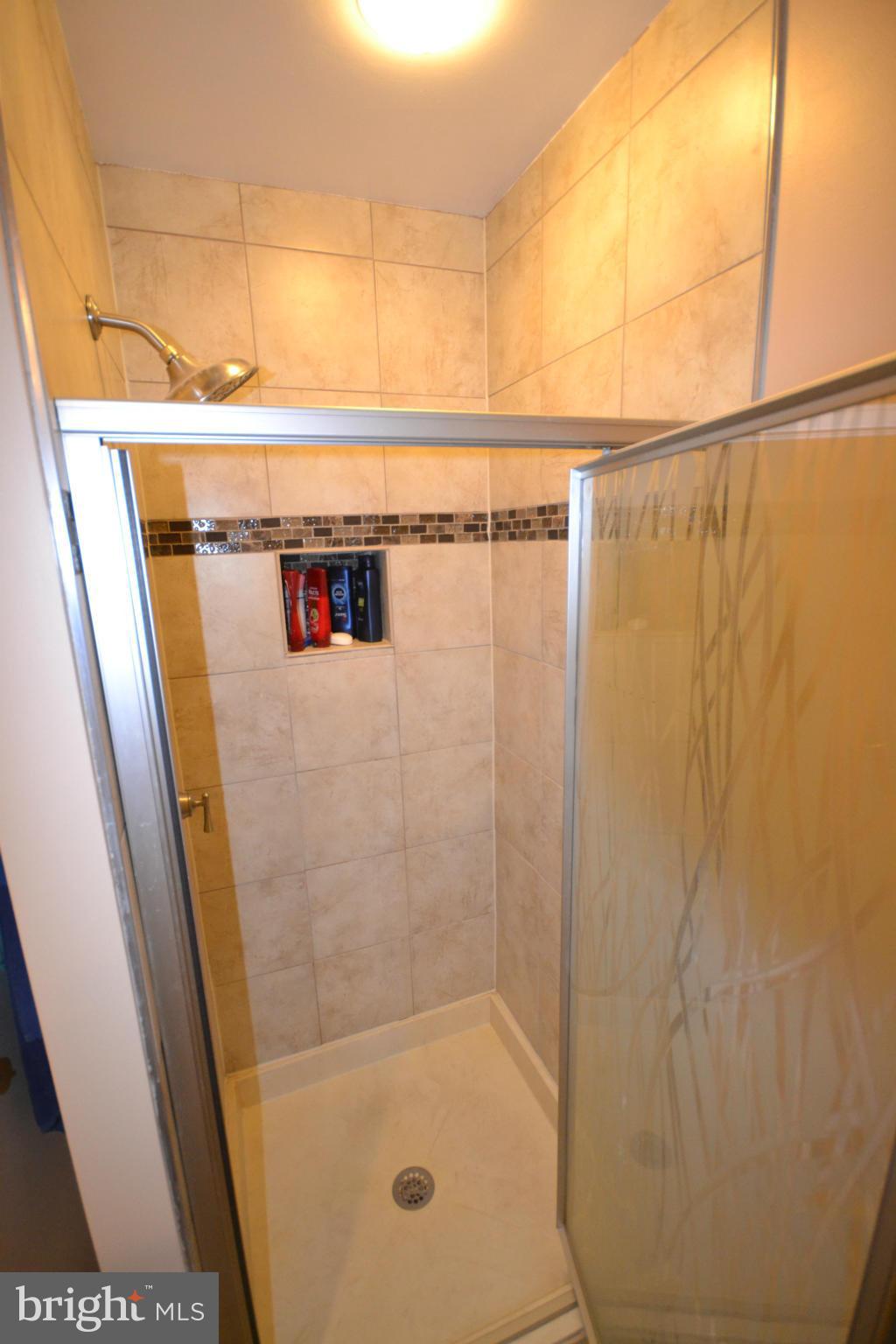3011 Fallstaff Road, Unit 301A Baltimore, MD 21209 - Photo 22 of 25 a bathroom with a shower and a sink