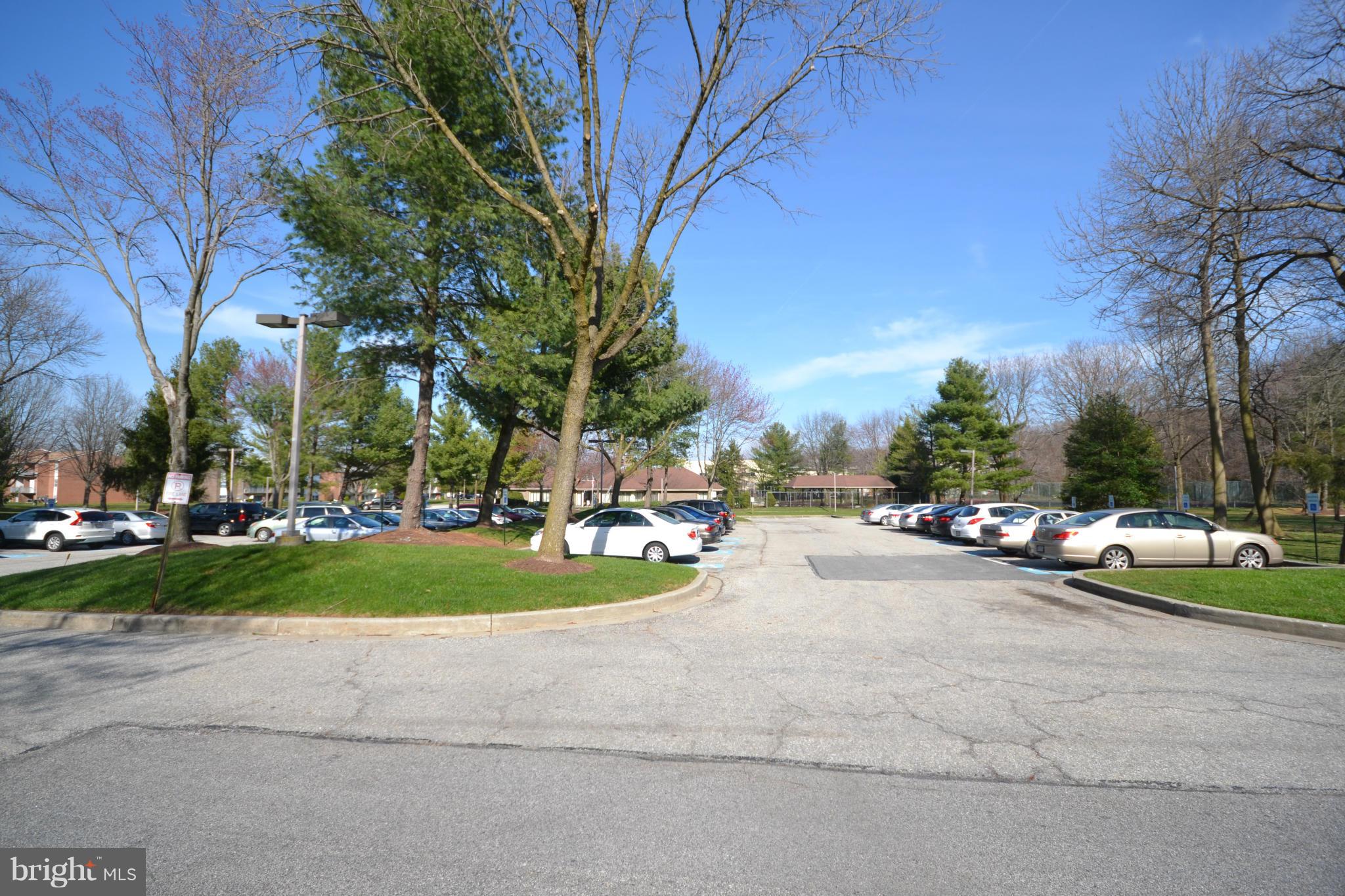 3011 Fallstaff Road, Unit 301A Baltimore, MD 21209 - Photo 23 of 25 a view of a park with cars parked in front of the house