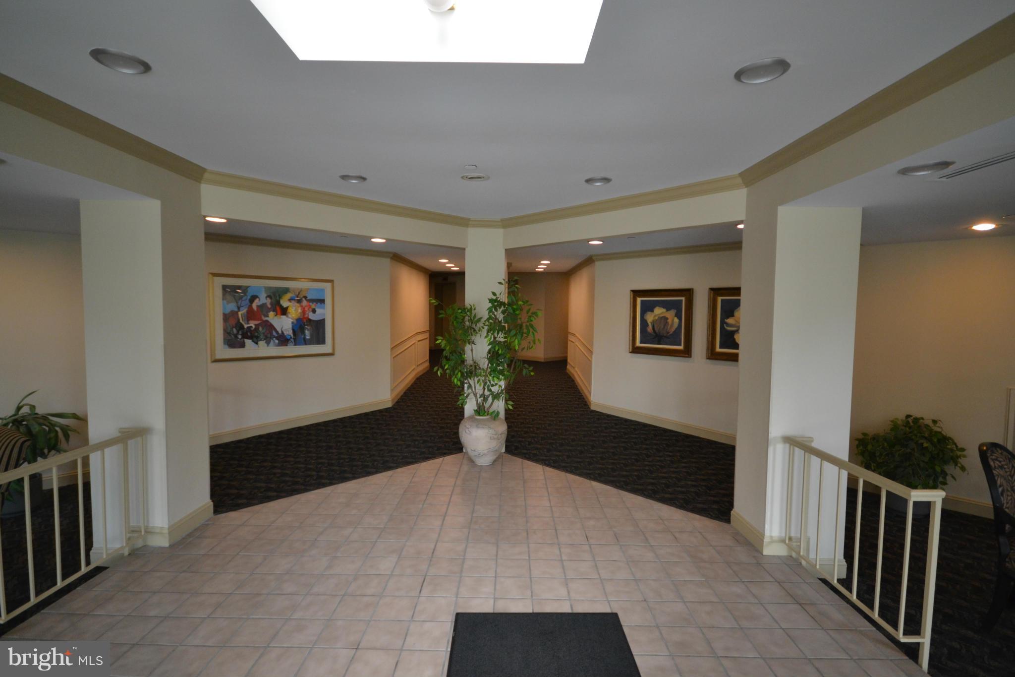 3011 Fallstaff Road, Unit 301A Baltimore, MD 21209 - Photo 4 of 25 a view of a hallway with closet