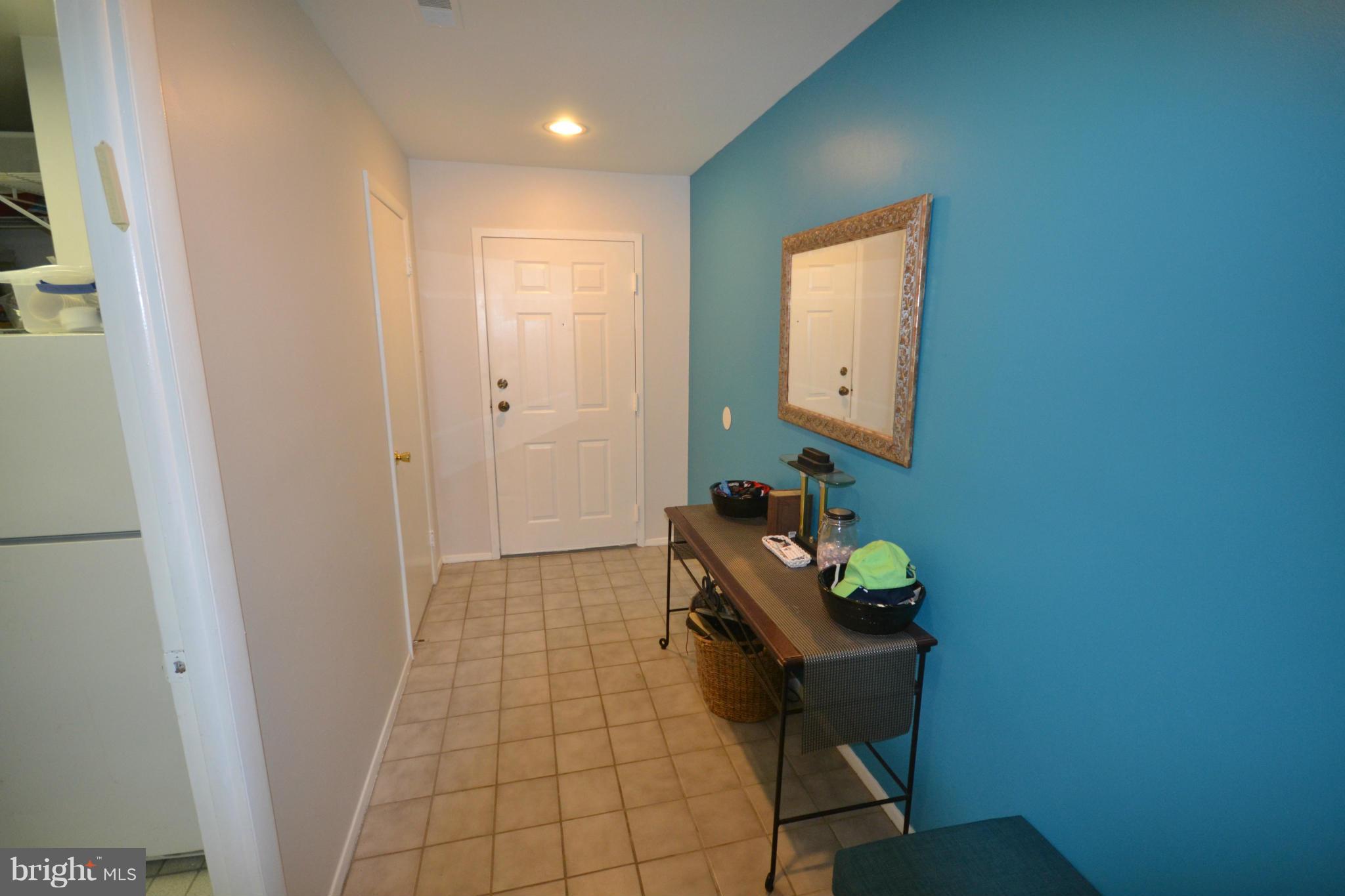 3011 Fallstaff Road, Unit 301A Baltimore, MD 21209 - Photo 6 of 25 a room with table and mirror