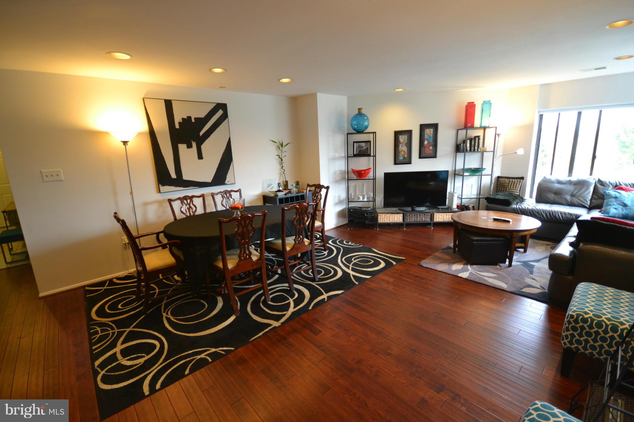 3011 Fallstaff Road, Unit 301A Baltimore, MD 21209 - Photo 10 of 25 a living room with furniture and a flat screen tv