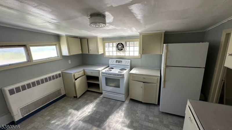 35 Cherry Street Washington, NJ 07882 - Photo 5 of 9 a kitchen with a refrigerator stove and a sink