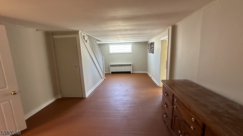 35 Cherry Street Washington, NJ 07882 - Photo 6 of 9 a view of a hallway with wooden floor and stairs