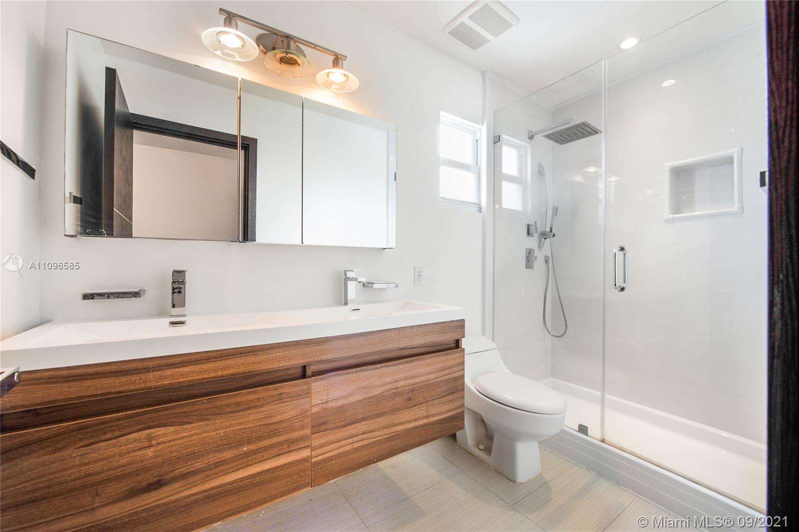 5131 Southwest 87th Avenue Miami, FL 33165 - Photo 17 of 24 a bathroom with a sink a toilet and shower