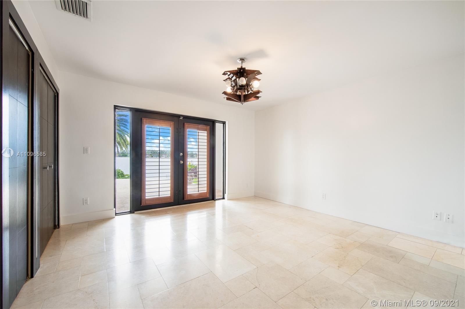 5131 Southwest 87th Avenue Miami, FL 33165 - Photo 18 of 24 a view of an empty room with a window