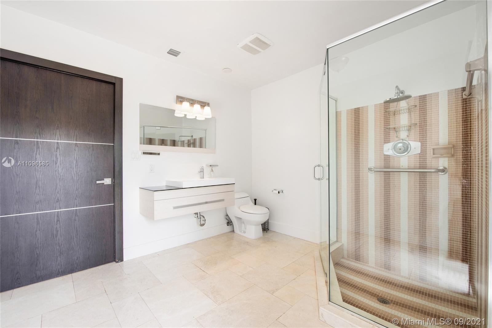 5131 Southwest 87th Avenue Miami, FL 33165 - Photo 19 of 24 a bathroom with a granite countertop sink mirror and toilet