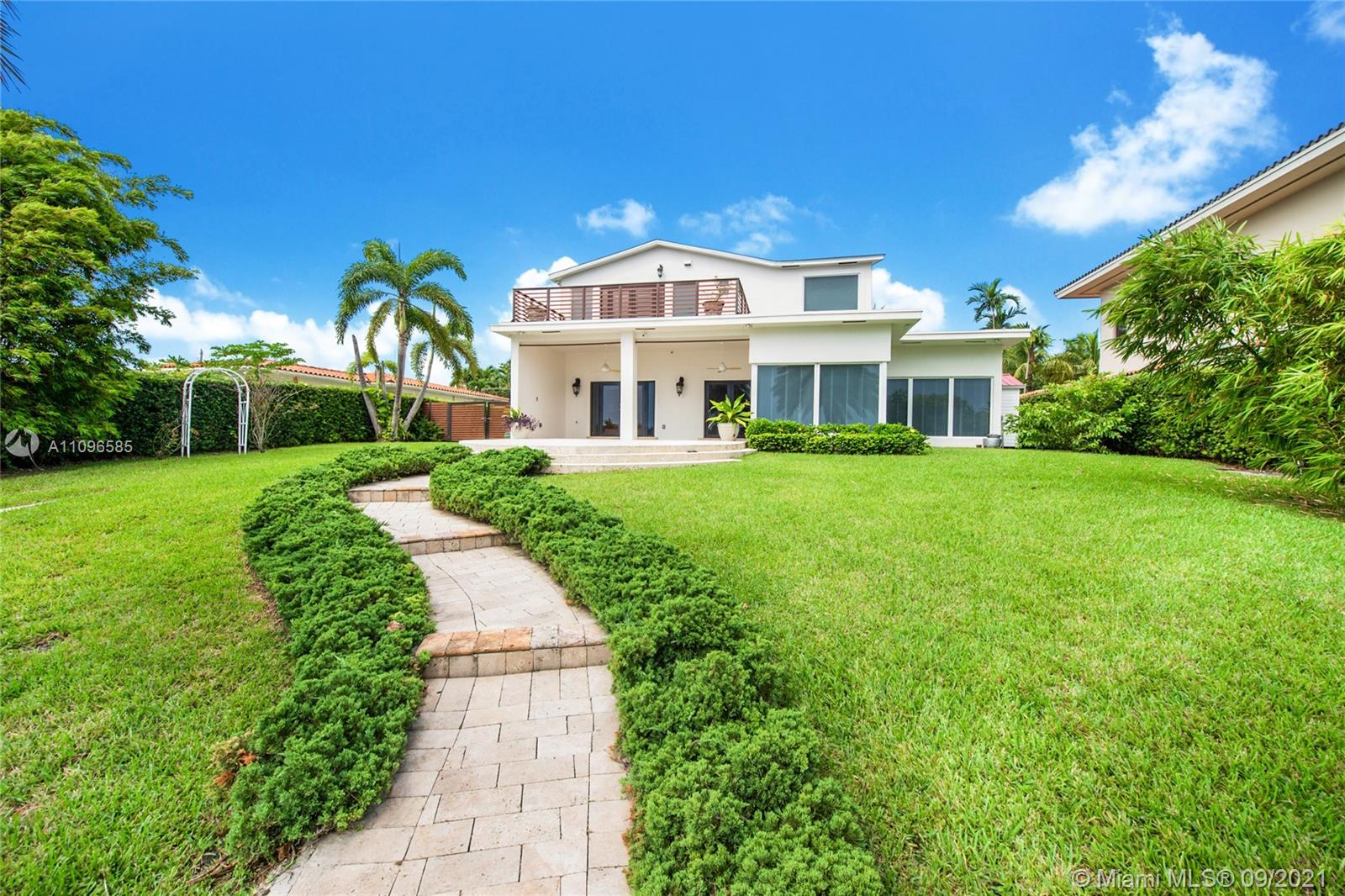 5131 Southwest 87th Avenue Miami, FL 33165 - Photo 20 of 24 a front view of a house with a garden