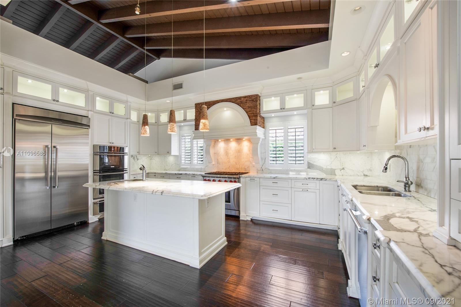 5131 Southwest 87th Avenue Miami, FL 33165 - Photo 3 of 24 a kitchen with a stove and a refrigerator