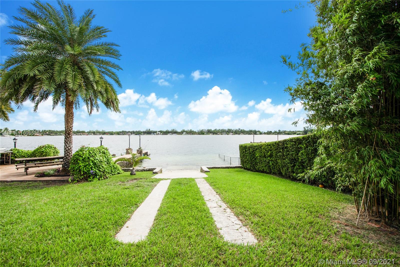 5131 Southwest 87th Avenue Miami, FL 33165 - Photo 22 of 24 a view of a swimming pool with a patio and a garden