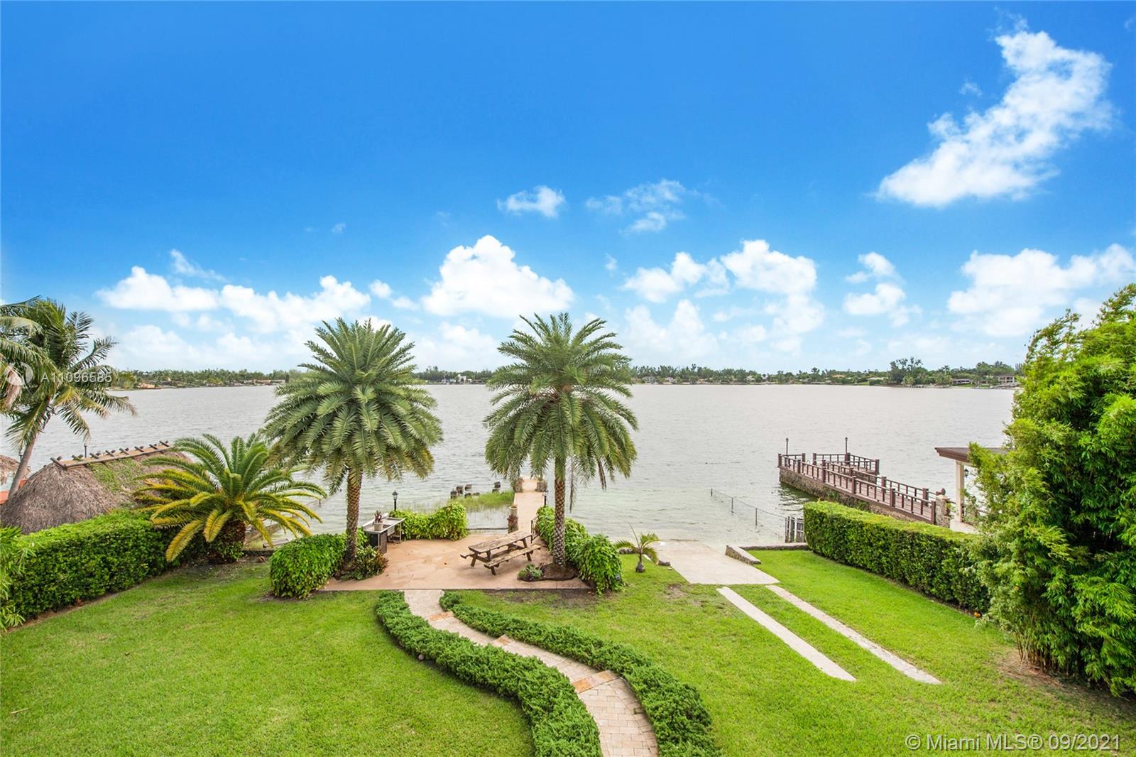 5131 Southwest 87th Avenue Miami, FL 33165 - Photo 24 of 24 a view of a swimming pool and lounge chairs