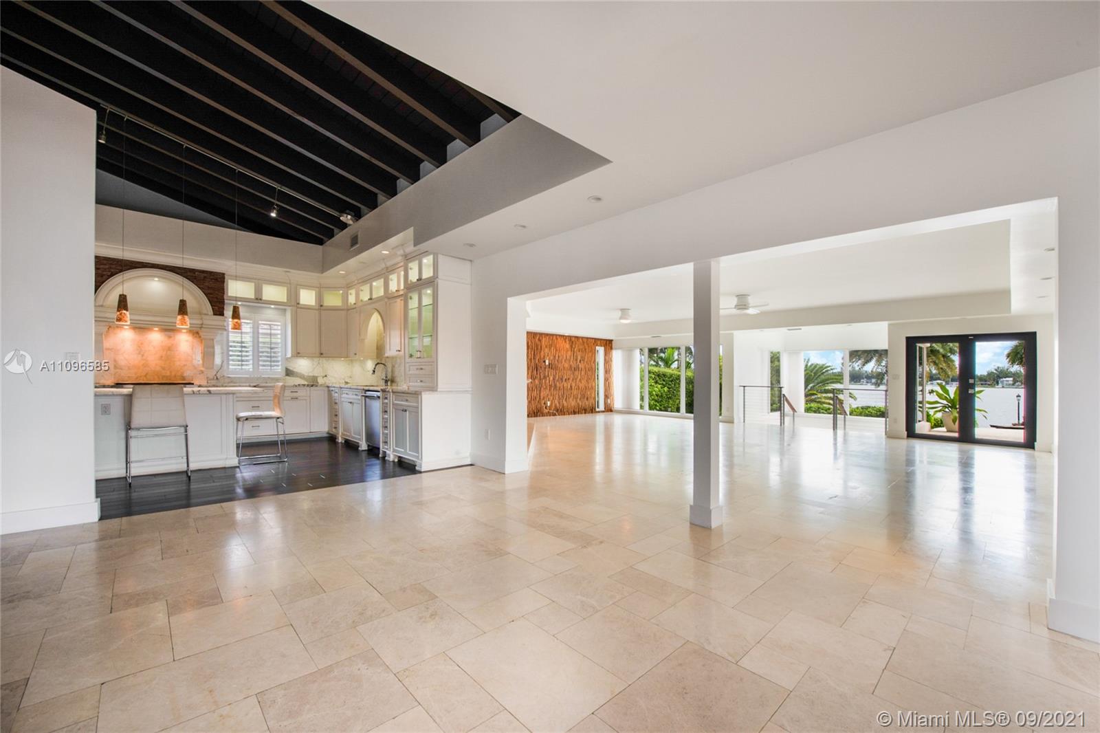 5131 Southwest 87th Avenue Miami, FL 33165 - Photo 4 of 24 a view of empty room with wooden floor and windows