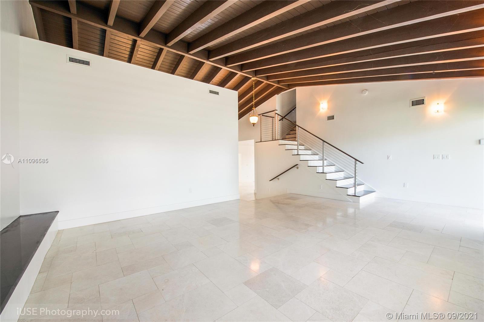 5131 Southwest 87th Avenue Miami, FL 33165 - Photo 5 of 24 a view of a room with racks on the wall