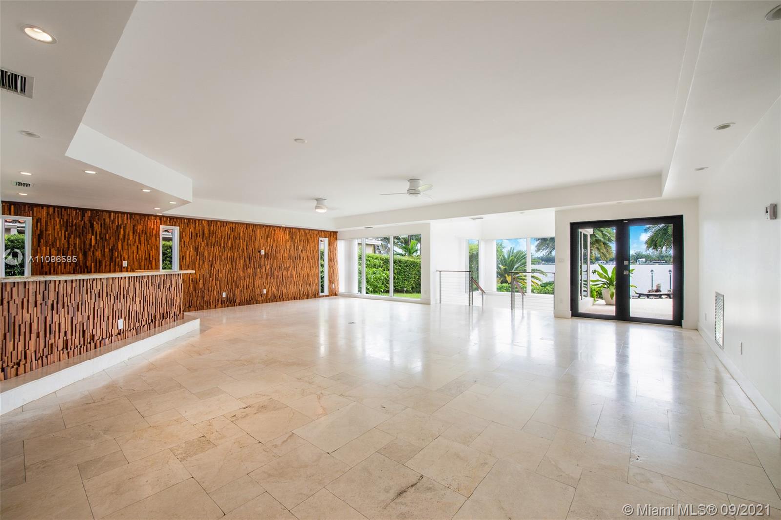 5131 Southwest 87th Avenue Miami, FL 33165 - Photo 8 of 24 a view of an empty room with wooden floor and a window