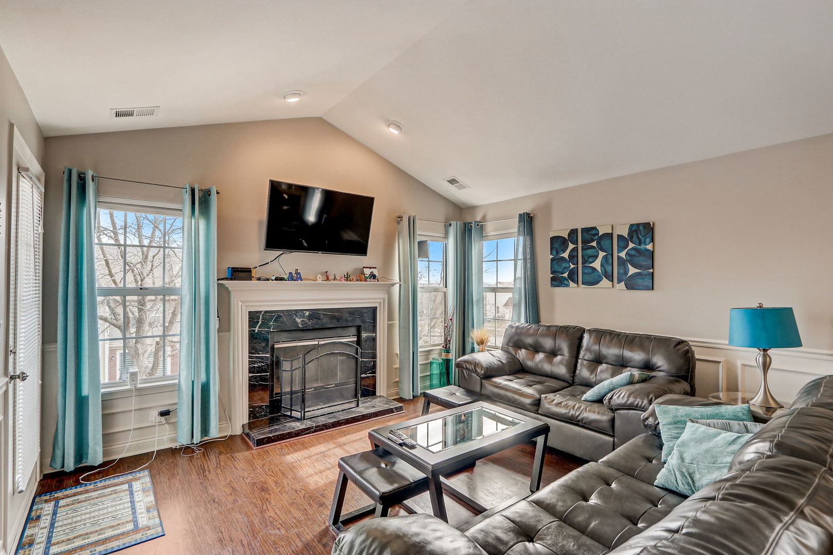 628 Village Road, Unit B Crystal Lake, IL 60014 - Photo 13 of 33 a living room with furniture a flat screen tv and a fireplace
