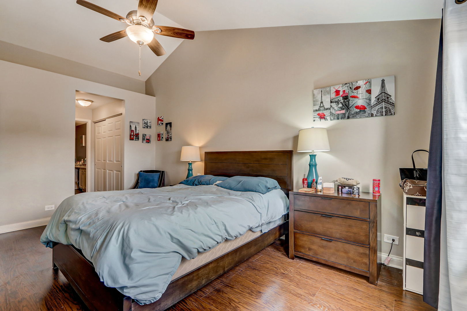 628 Village Road, Unit B Crystal Lake, IL 60014 - Photo 19 of 33 a bedroom with a bed and a chandelier