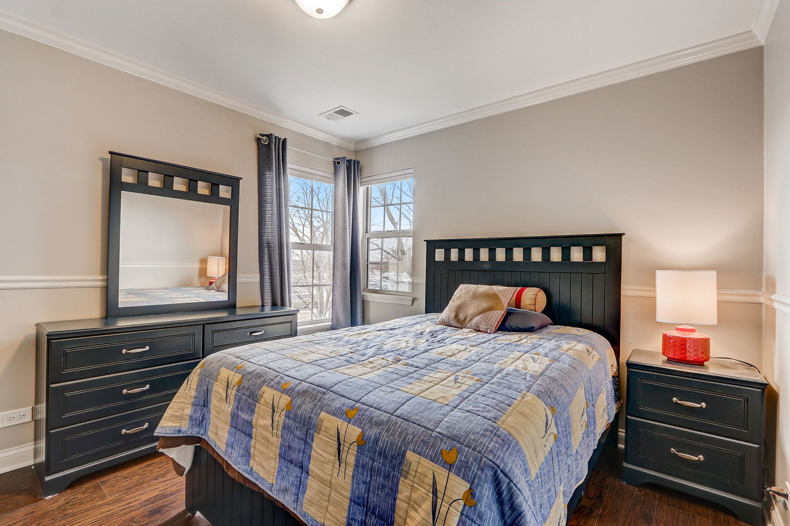 628 Village Road, Unit B Crystal Lake, IL 60014 - Photo 24 of 33 a bedroom with a bed and a dresser