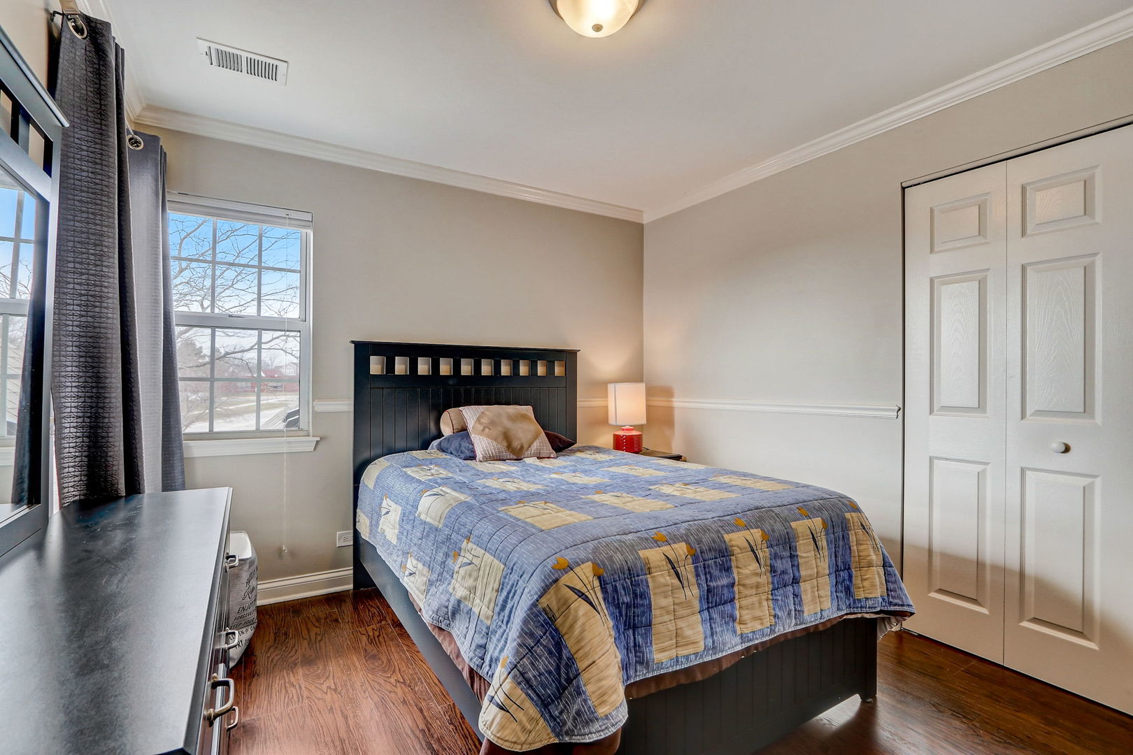 628 Village Road, Unit B Crystal Lake, IL 60014 - Photo 25 of 33 a bedroom with a bed a window and wooden floor