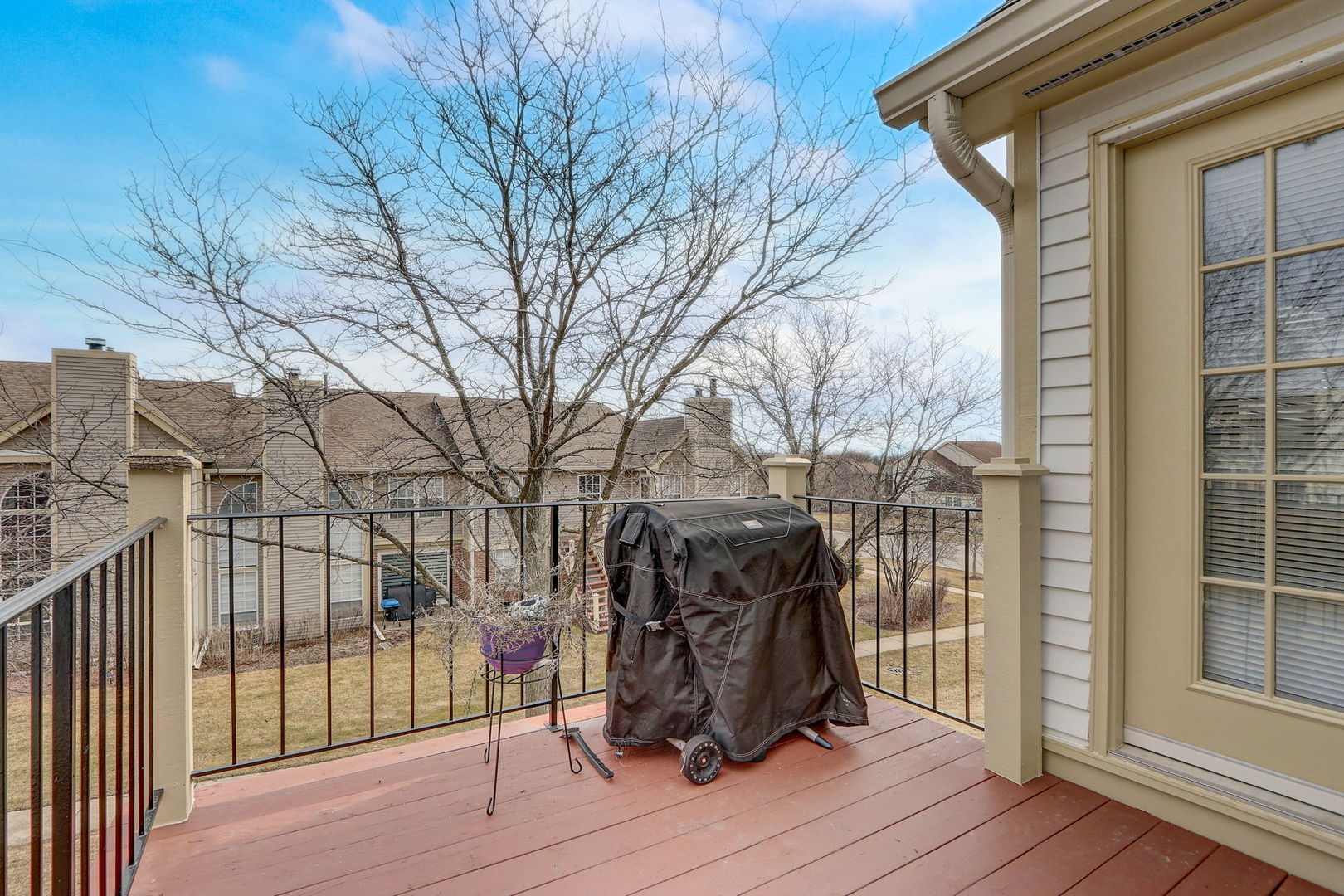 628 Village Road, Unit B Crystal Lake, IL 60014 - Photo 30 of 33 a view of a house with a wooden bench