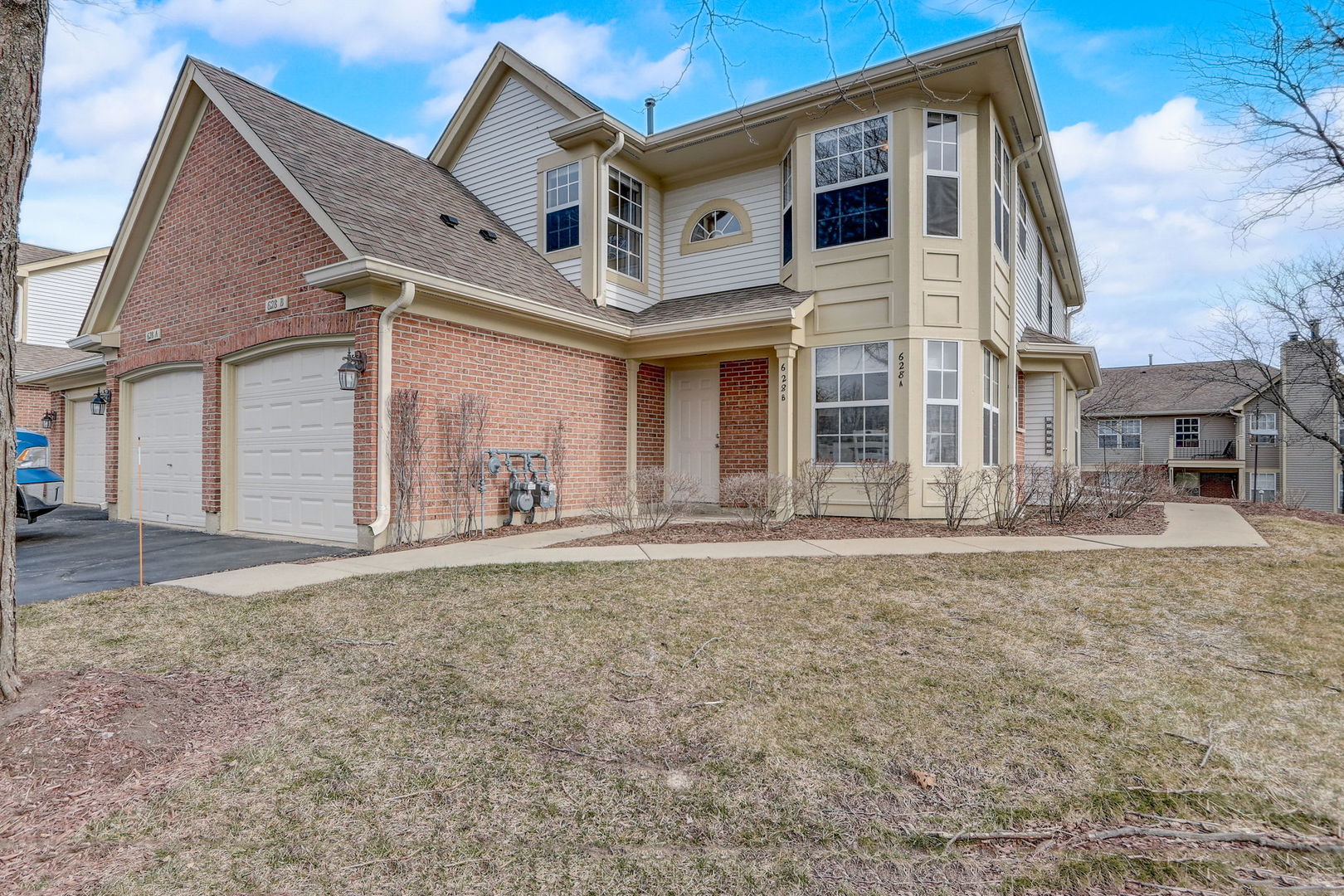 628 Village Road, Unit B Crystal Lake, IL 60014 - Photo 3 of 33 a front view of a house with a yard